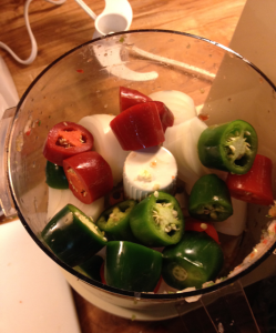 Fresh cut peppers in glass, ready to be added to the homemade salsa.