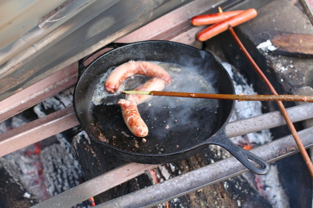 brats cooking in maple tree sap